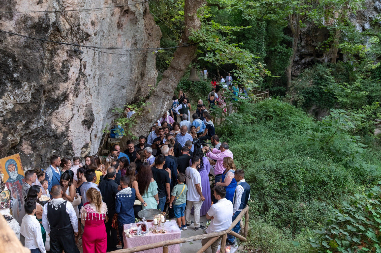 "Traditional wedding ceremony and mystery at the cave chapel of St. Anthony in Patsos Gorge, Rethymno, Crete, nestled within a unique natural landscape."